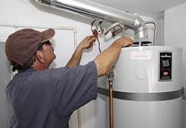 Phill is adjusting a conventional water heater